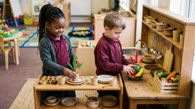 Students role playing in a kitchen